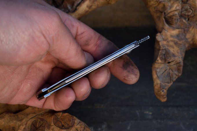 Couteau pliant à friction, manche en acier, système deux clous